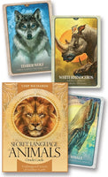 The Secret Language of Animals Oracle Cards featuring Timber Wolf, White Rhinoceros, and Whale cards for spiritual guidance