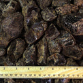 Raw brown rough crystals with ruler for size reference, metaphysical healing stones