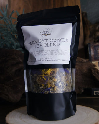 Midnight Oracle Tea Blend herbal loose leaf tea in black resealable pouch on wooden surface