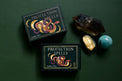 Protection Spells tarot deck with crystals on dark green background, metaphysical supplies