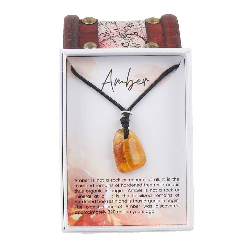 Amber crystal pendant necklace on black cord in gift box with descriptive card