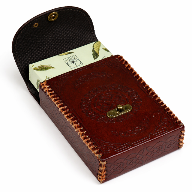 Celtic embossed leather tarot card case with green botanical tarot deck