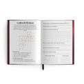 Open tarot journal with Golden Reflections tarot spread layout and guided reflection prompts.